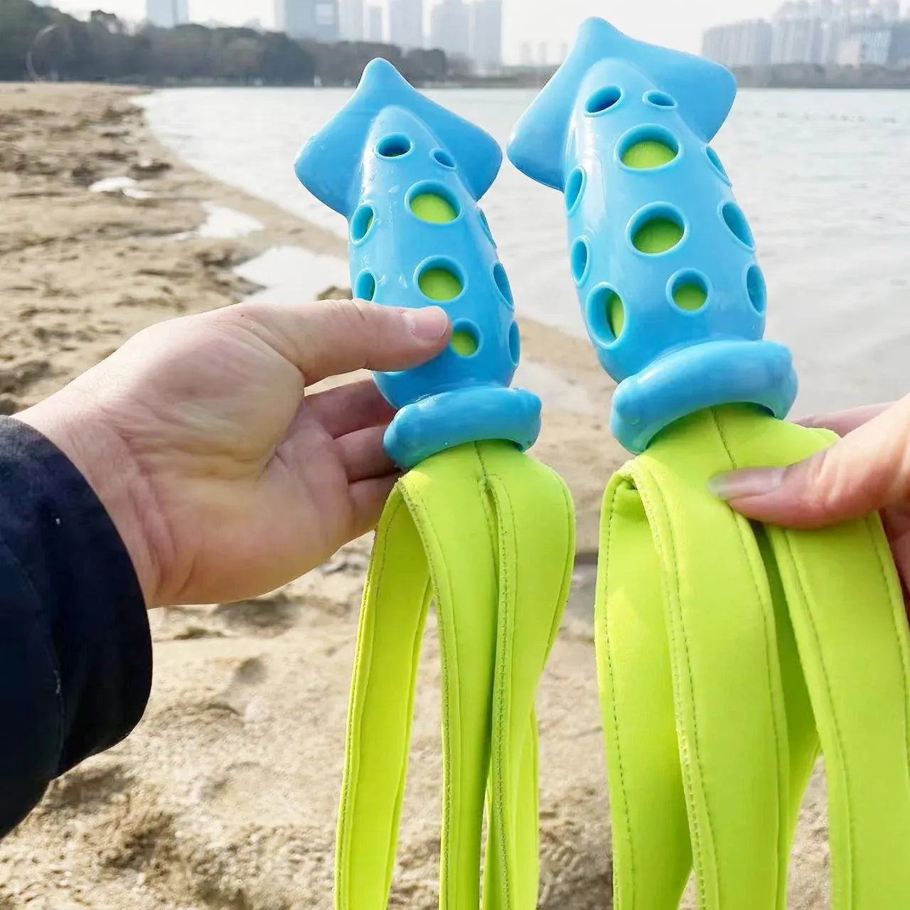 Blue cuttlefish-shaped dog chew toy with squeaky sound device for interactive play