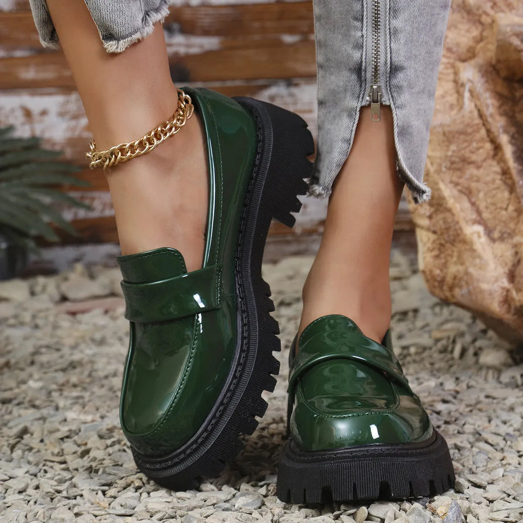 Black plus size women's loafers with a chunky platform heel and slip-on design.