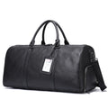 Men's black leather excursion tote bag with single shoulder strap shown alongside coffee brown version
