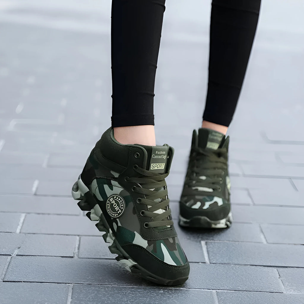 Women's green camouflage print canvas sneakers with rubber sole and lace-up closure.