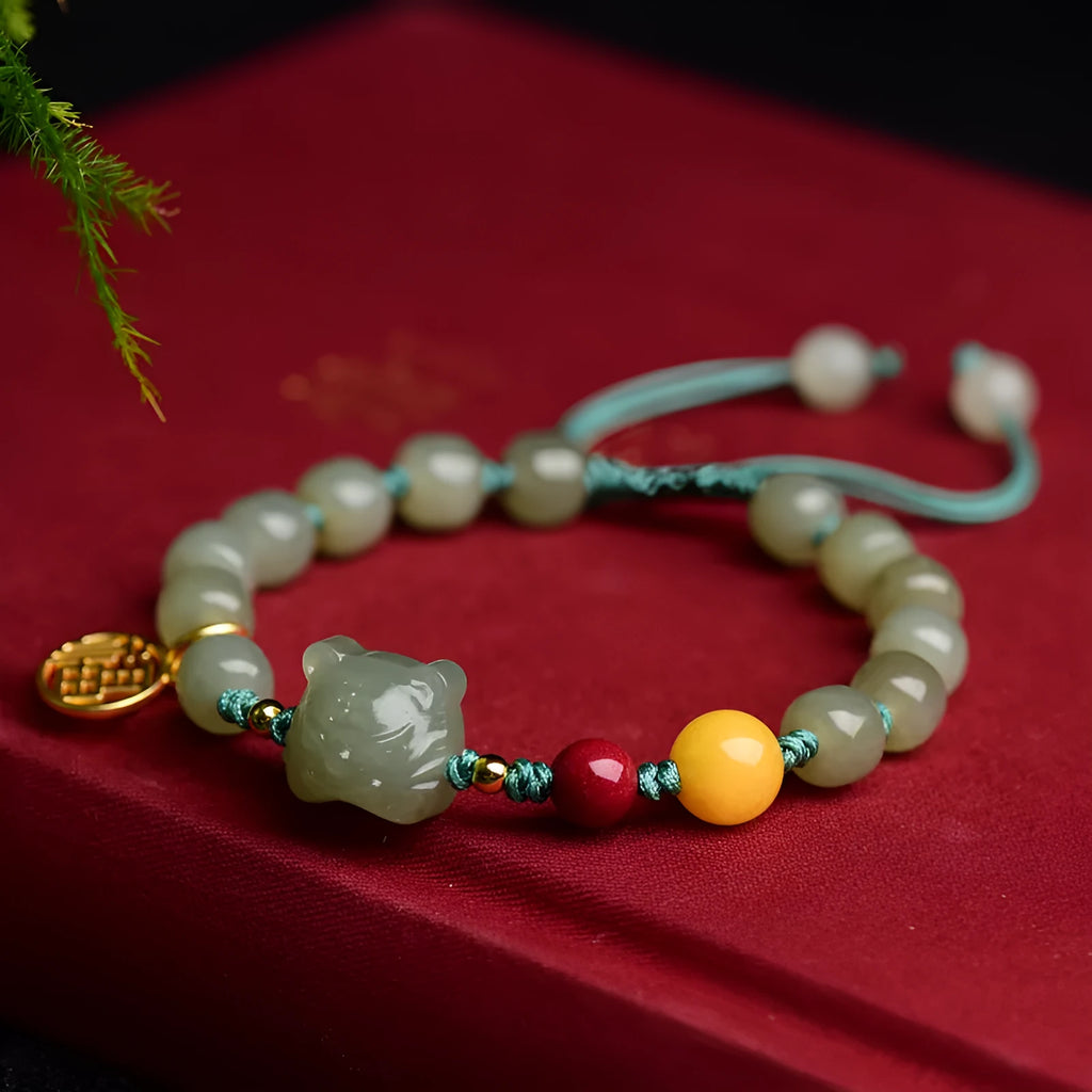 Natural Hetian jade bracelet with red cinnabar and amber beeswax beads, animal zodiac design