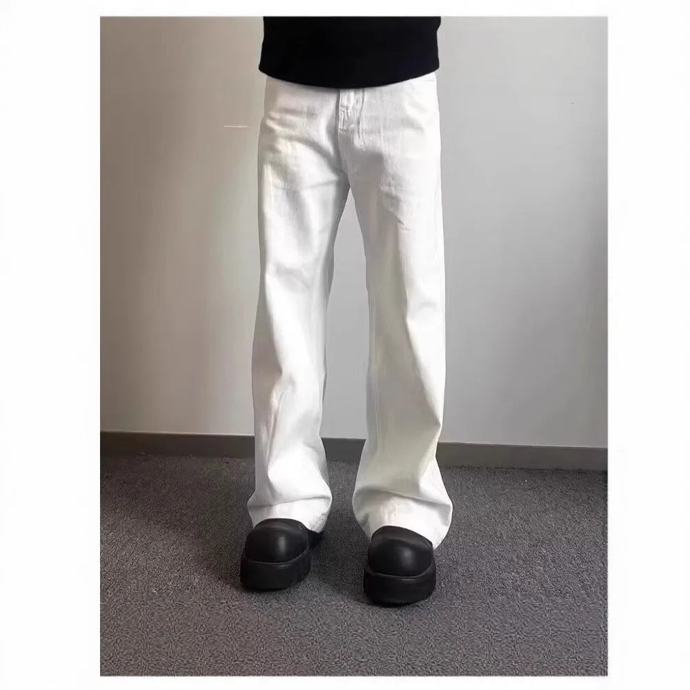 Men's white straight wide-leg denim jeans on a mid waist, showing zipper fly and relaxed fit.