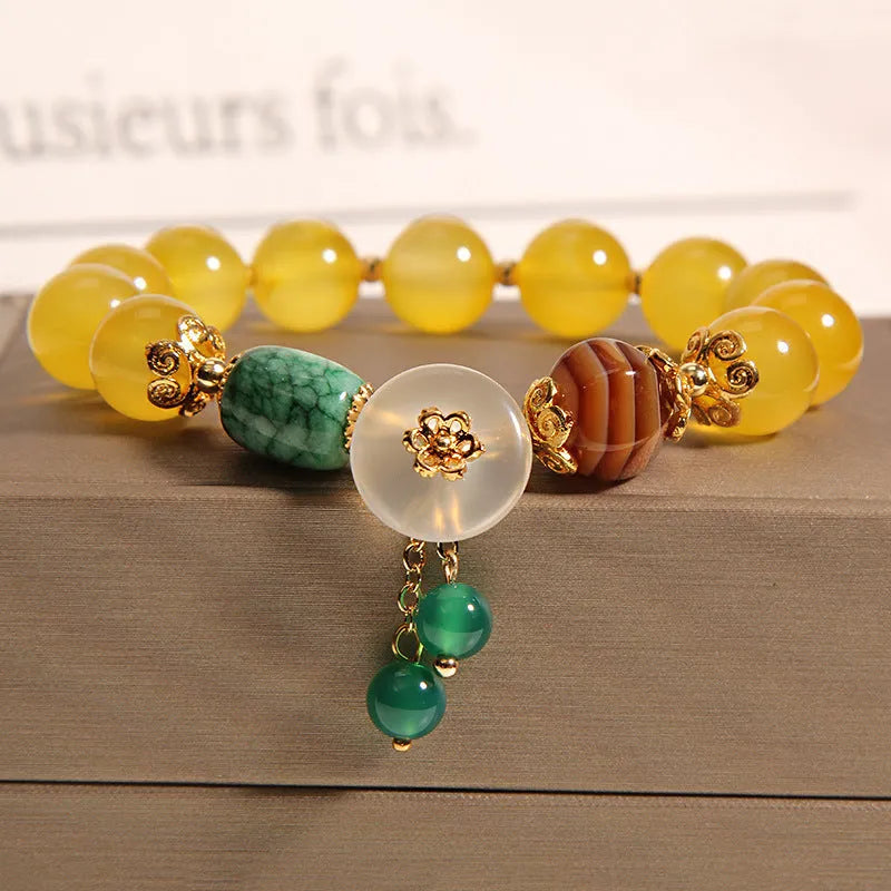 Women's yellow agate crystal bracelet with gold silk cord in adjustable khaki design