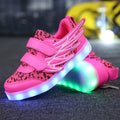 Children's plum red and white light-up sneakers with colourful luminous wings pattern and USB charging port.