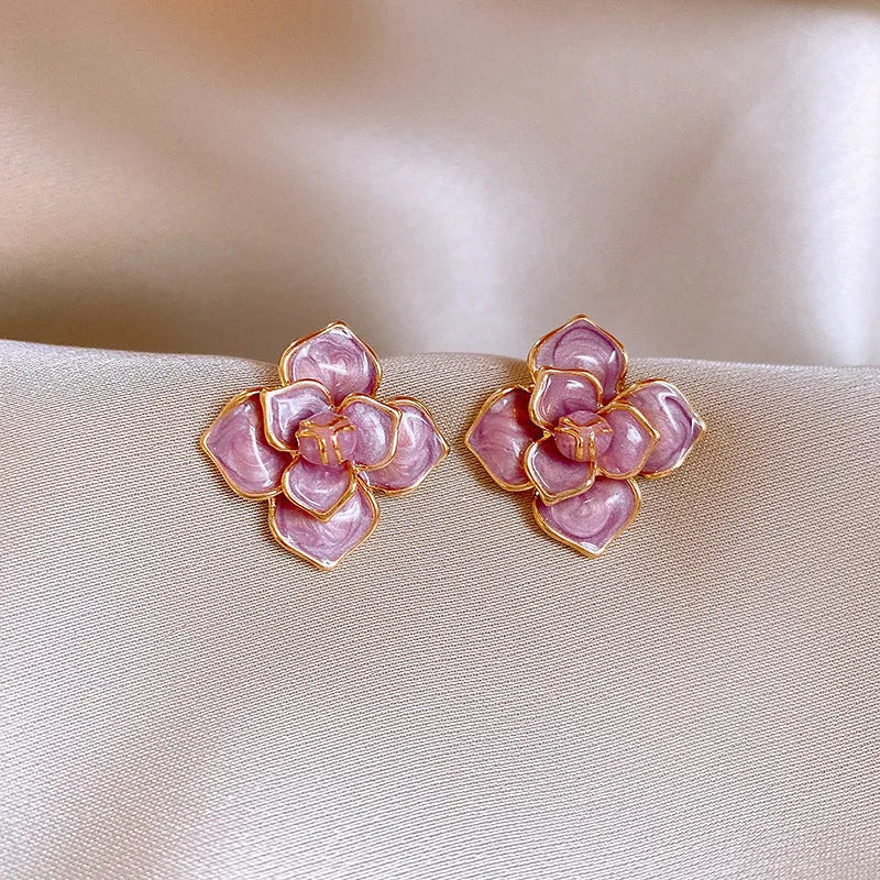Gold plated copper flower stud earrings with purple oil-spot glaze finish and floral shape design