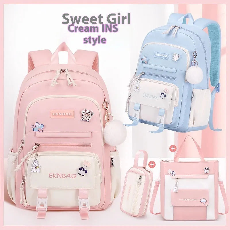 Pink waterproof Oxford cloth school backpack for girls with curved shoulder straps, shown with a matching pencil case.