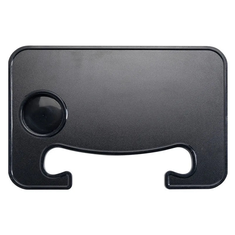 Black foldable car steering wheel laptop stand with a drink cup holder on a table.