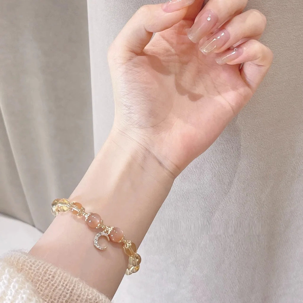 Chinese style women's crystal bracelet with 14K gold electroplating, moonstone, and golden sun stone fortune crystal design