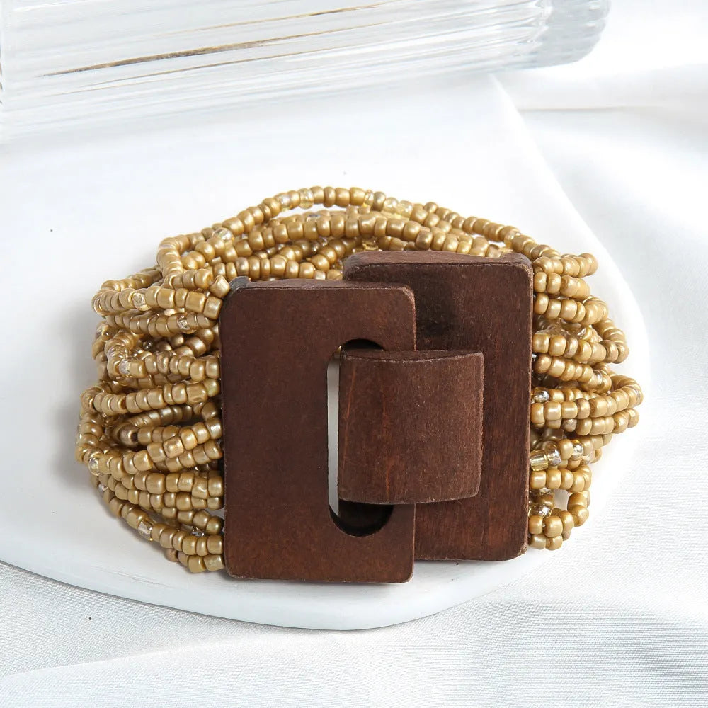 Handmade multi-layer elastic bracelet with rice-shaped glass and coloured glaze beads in geometric quadrilateral pattern, six colour options