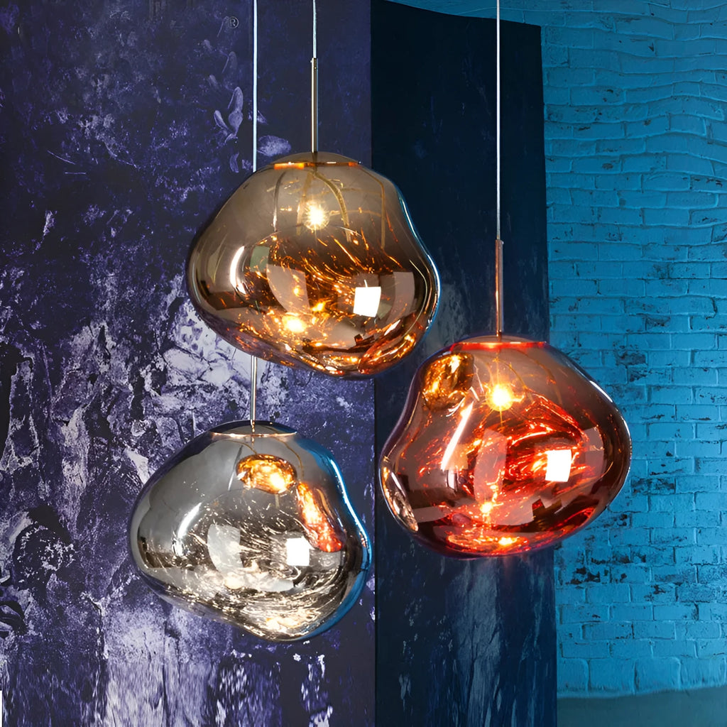Nordic post-modern chandelier with irregular lava lamp glass design in gold finish.