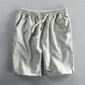 Men's striped casual shorts in light blue with a loose straight fit and mid waist.