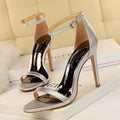 Women's open-toe high heel sandals with buckle-fastened ankle strap in artificial PU material.