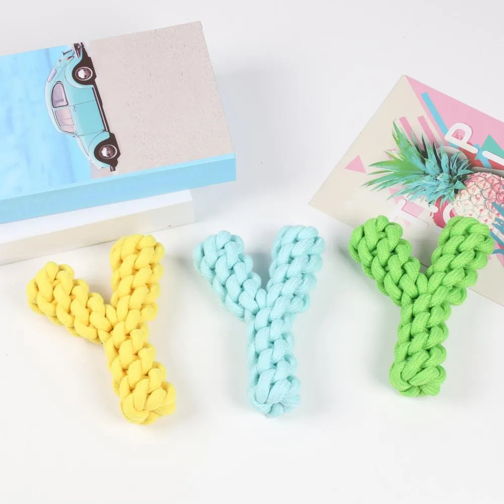 Blue Y-shaped cotton rope dog chew toy for large breeds on a wooden floor.