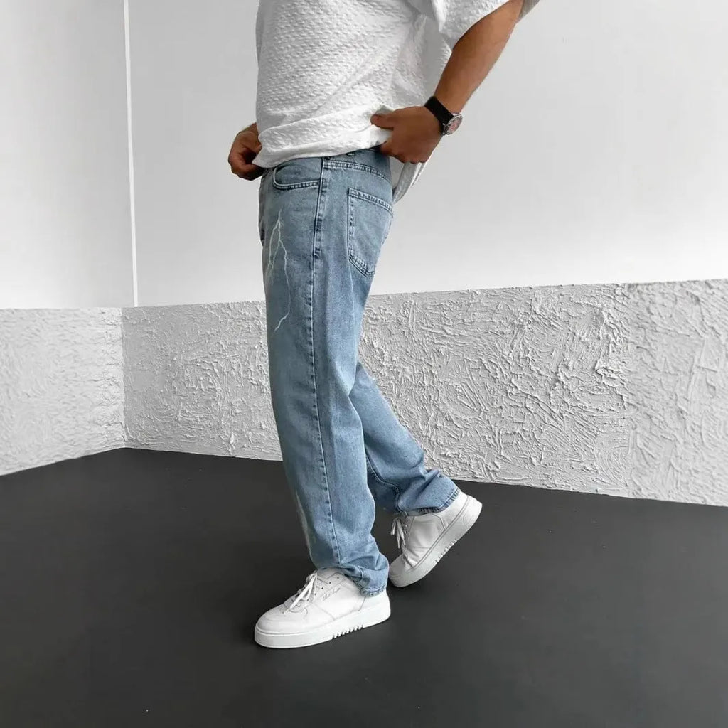 Men's blue straight-leg denim jeans with wide-leg fit and medium elasticity