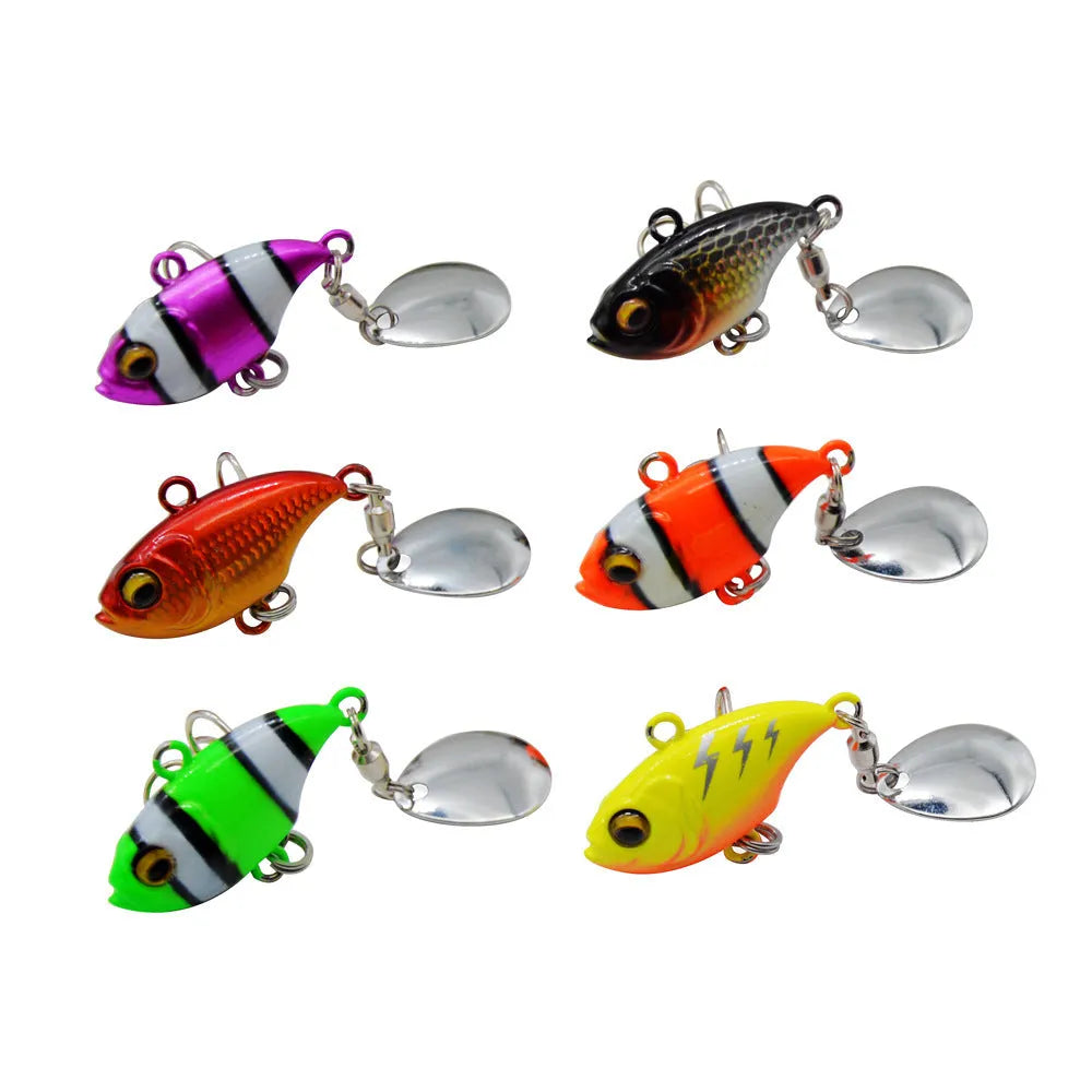 Metal fishing lure with a rotating sequin in a selection of colours on a blue background.