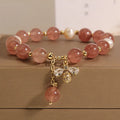 Women's alloy bracelet with three strawberry quartz stones, freshwater pearls, and zircon accents.