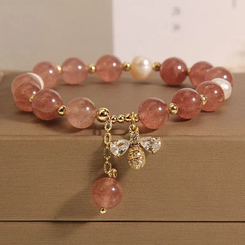Women's alloy bracelet with three strawberry quartz stones, freshwater pearls, and zircon accents.