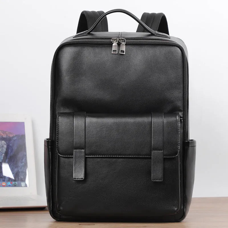 Black genuine leather men's laptop backpack with woven details and adjustable straps.