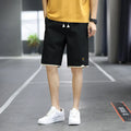 Men's loose-fit casual shorts in polyester fabric, shown in a solid colour with a straight Korean-style cut.