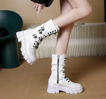 Women's black mid-calf knight boots with a large metal buckle and side zip.