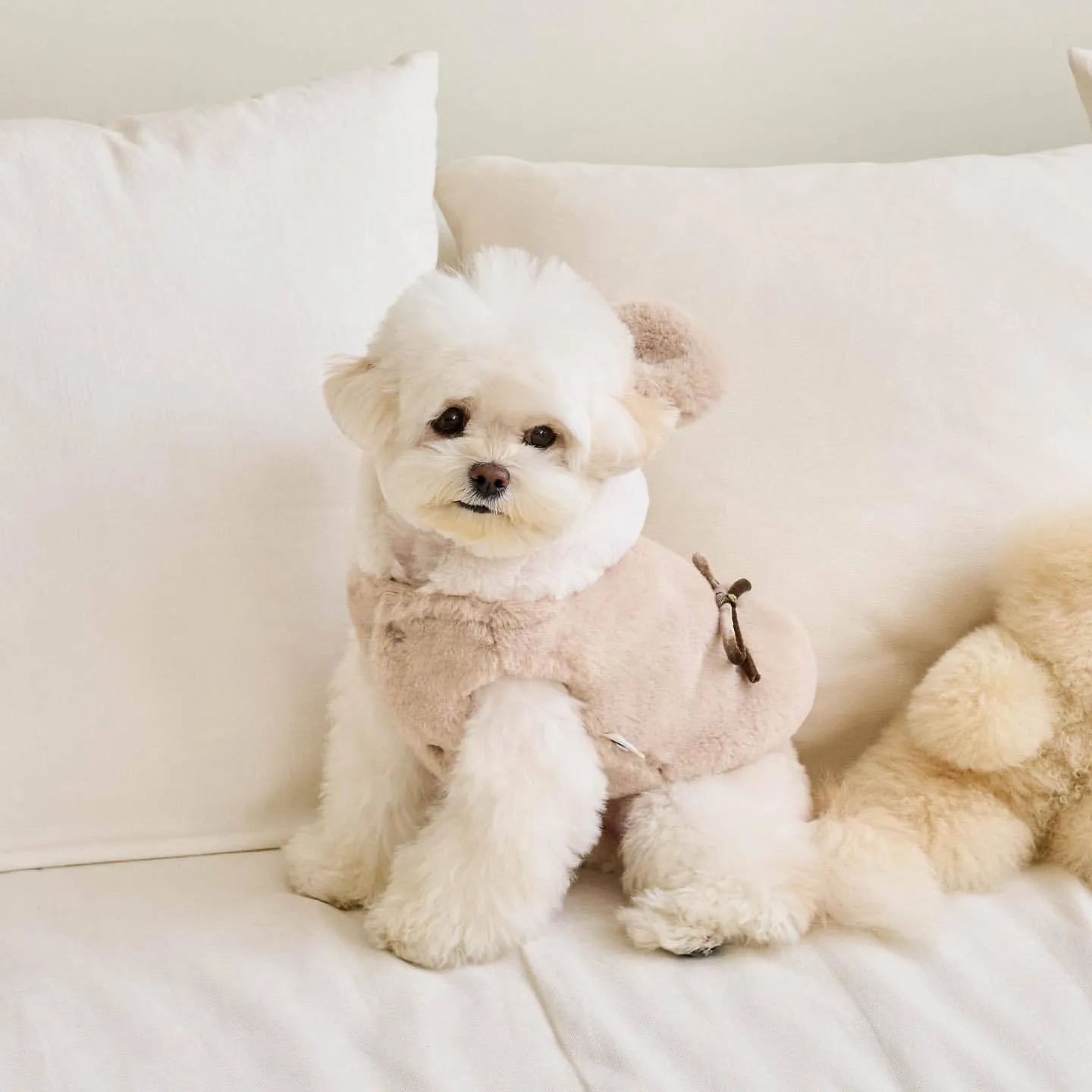 Light pink polyester warm coat for a dog or cat, showing casual costume style.