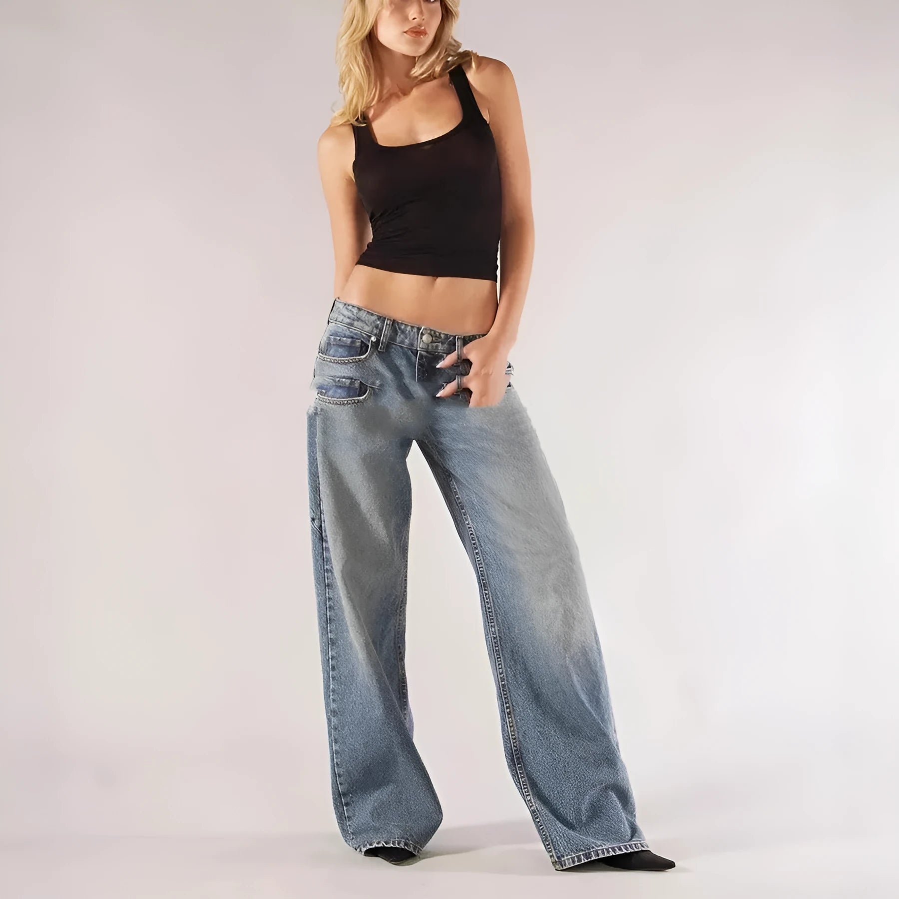 Women's loose blue cotton wide leg trousers with colour block panelling on a low waist.