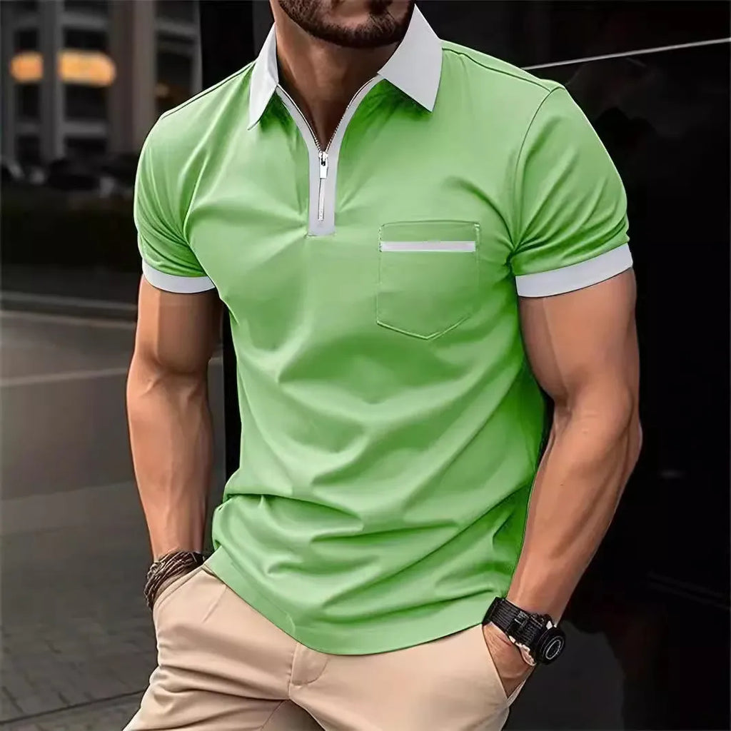 Man wearing a loose-fit short sleeve casual shirt with a chest pocket and zipper detail.