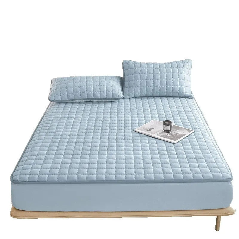 Blue waterproof fitted sheet with elastic corner stretched over a mattress.