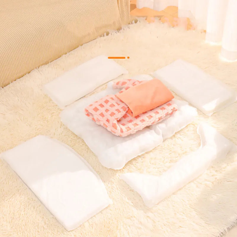 Green triangular cat bed with removable sponge pad, shown disassembled for washing.