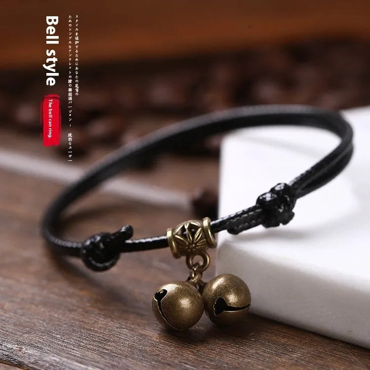 Nylon rope dog collar with brass bell shown in black, red, and coffee colours