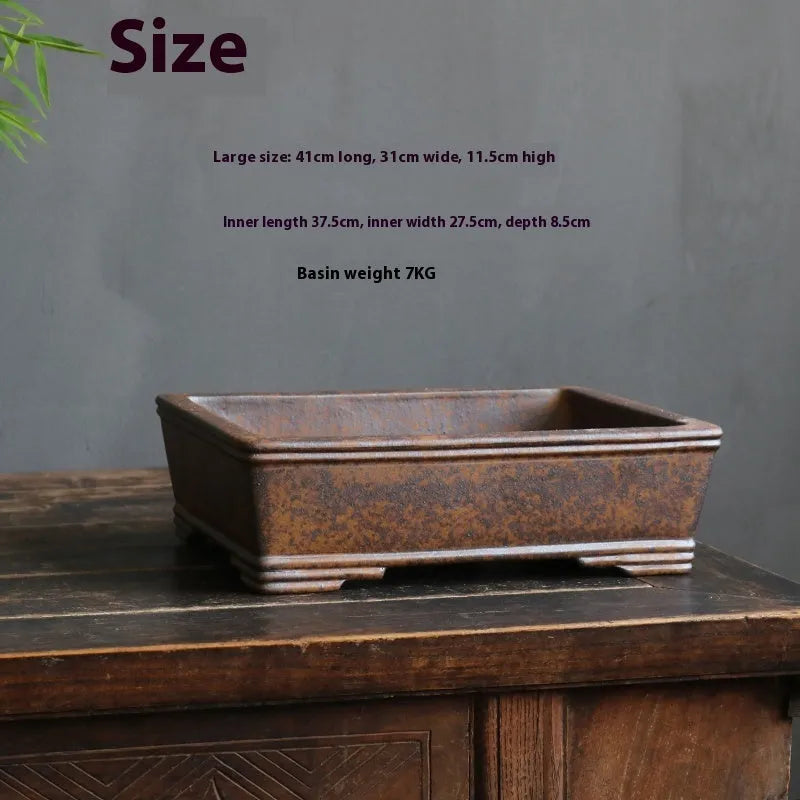 Rectangular purple sand bonsai pot with rustic firewood texture, shown empty for scale.