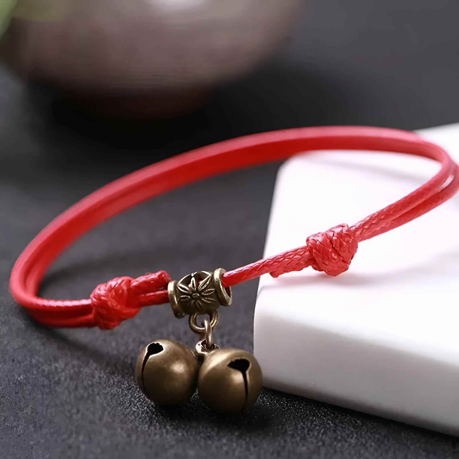 Adjustable nylon dog collar with brass bell and buckle in black, red, or coffee rope.