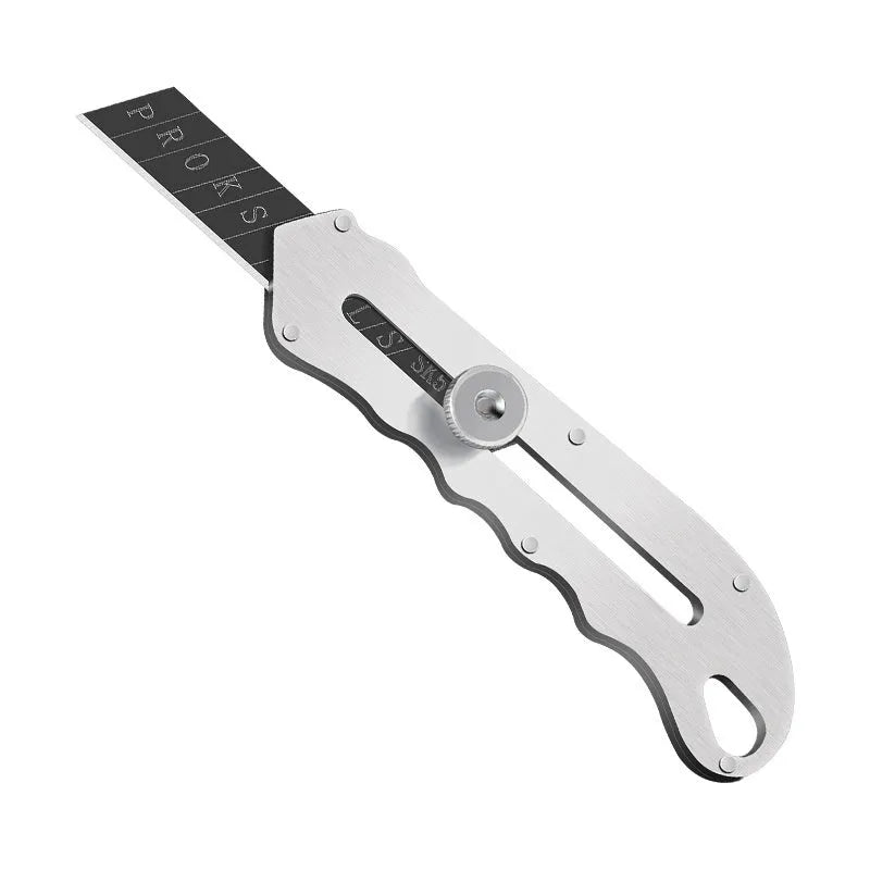 Stainless steel folding art knife with a black blade, shown with a set of long and trapezoidal spare blades.