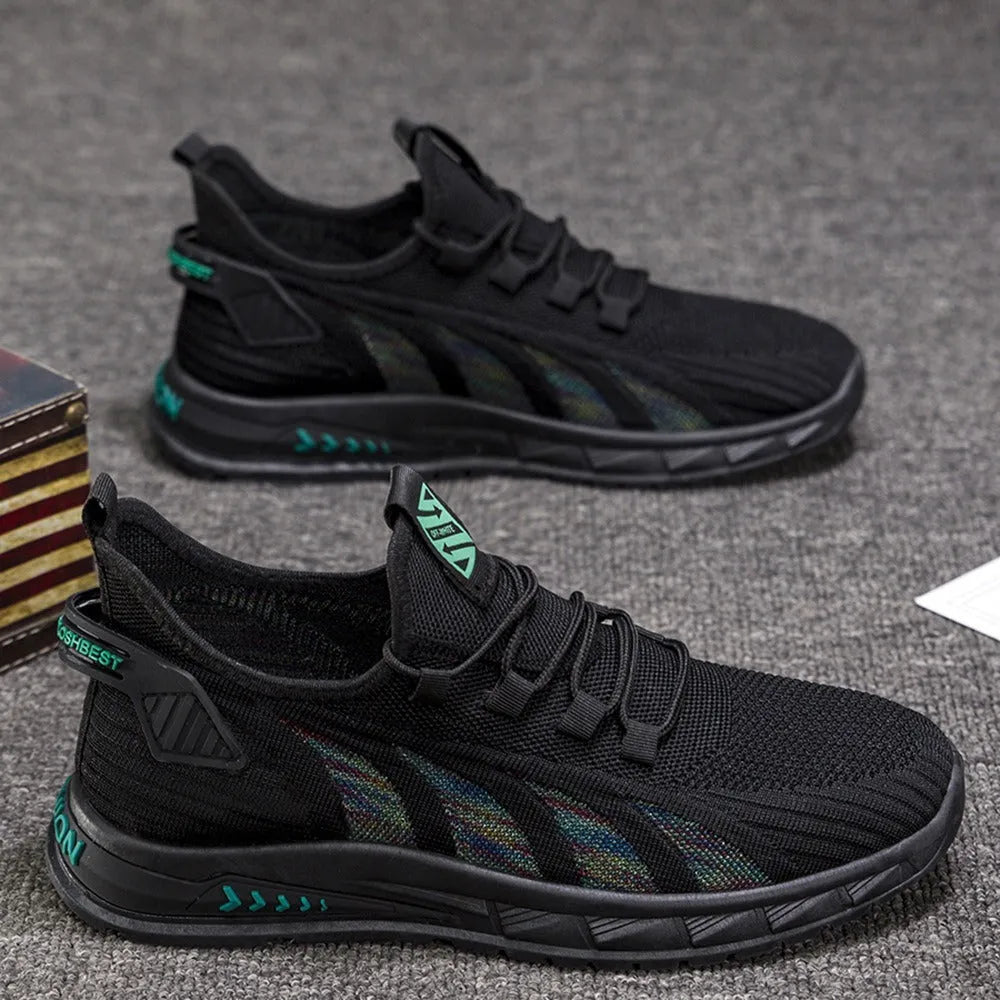 Low-top casual sneakers with mesh upper in colours black, grey, and beige on a flat plastic sole