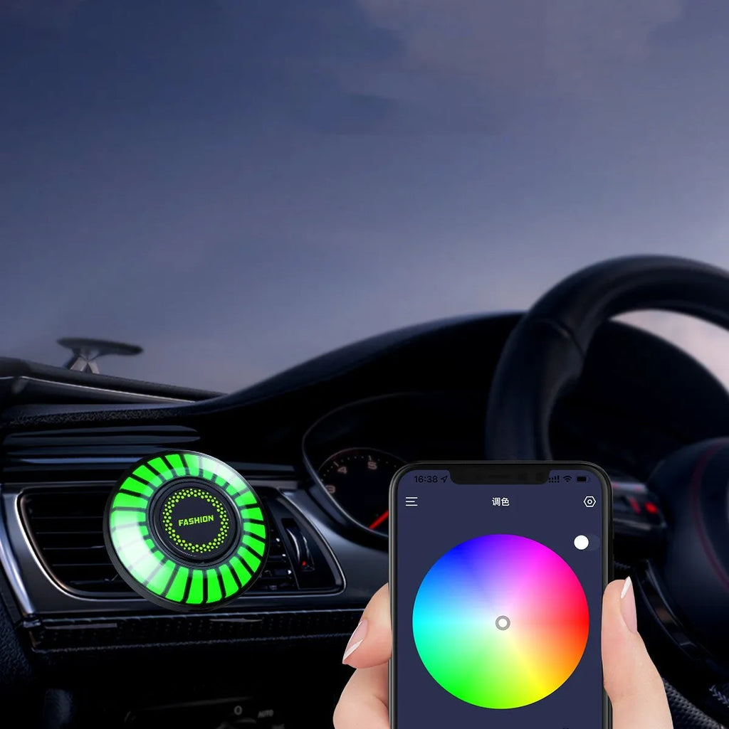 Car air vent aromatherapy unit with colourful RGB lights and choice of scent styles.