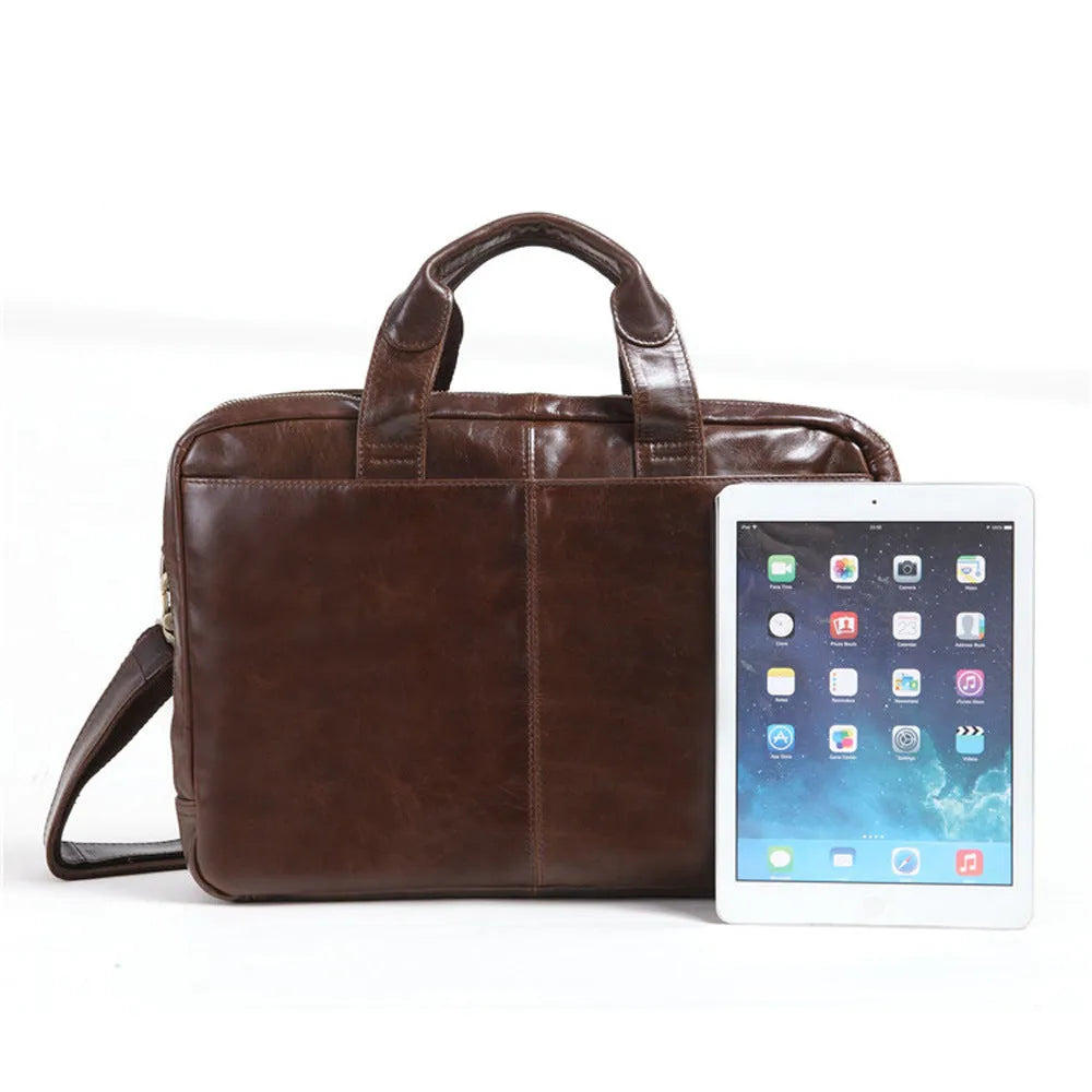 Brown leather business briefcase with visible cowhide pattern, measuring 18 inches with internal polyester cotton lining