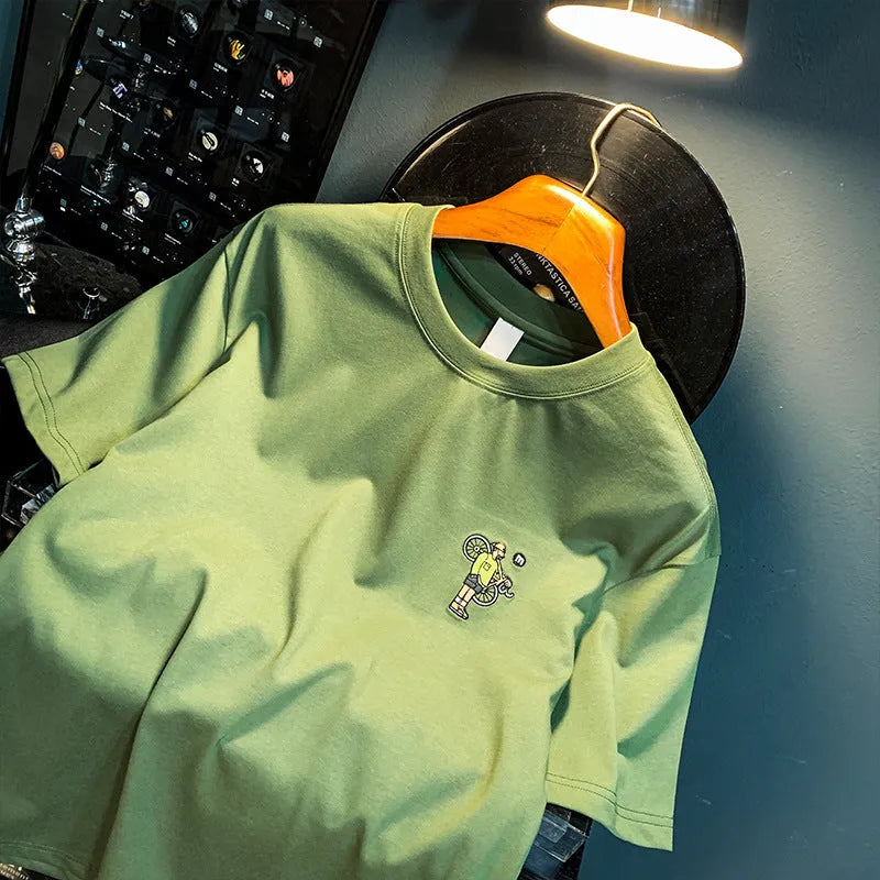 Green men's loose fit t-shirt with a literary design print on the front.