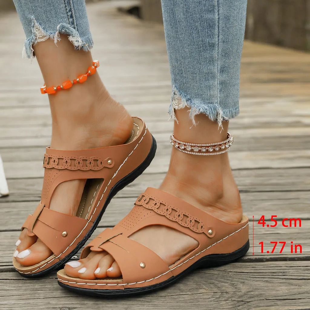 Slope heel roman style slippers in PU with fish mouth toe, shown in available colours.