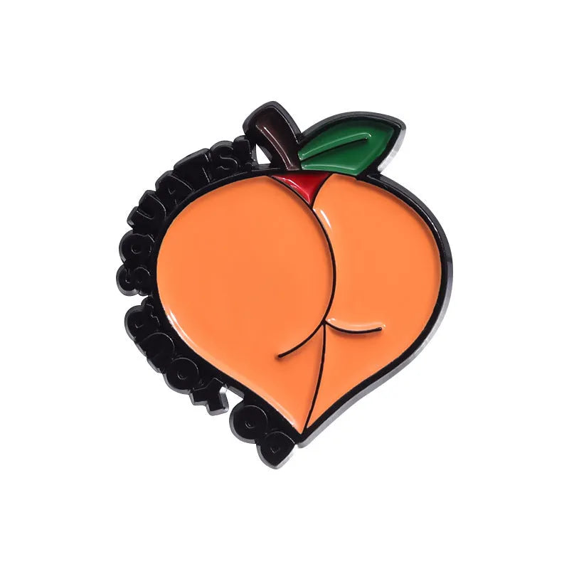 Colourful cartoon fruit and letter design on a metal brooch pin with a secure clasp.