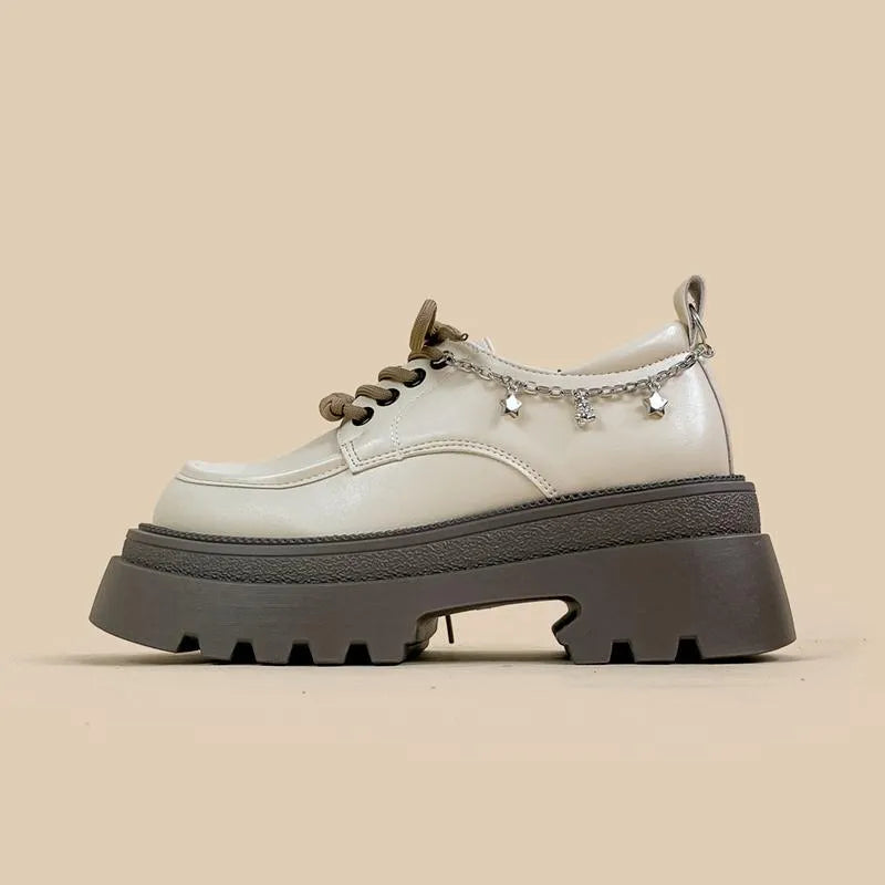 White women's platform leather shoes with lace-up front and a thick chunky heel.