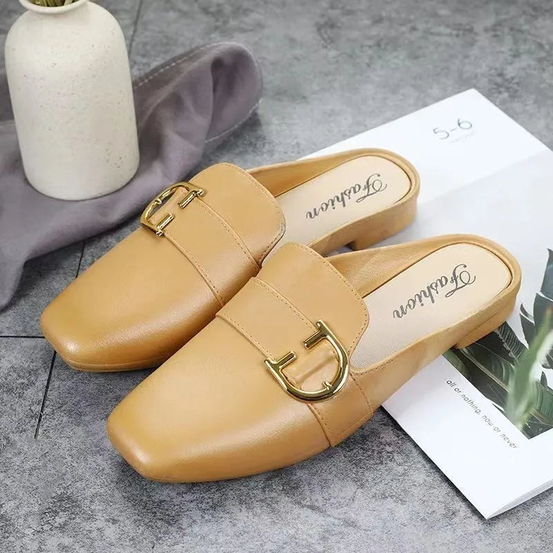 Women's closed toe PVC half slipper in milky white with a double buckle fastening.