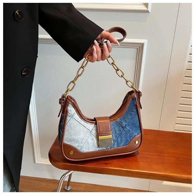 Brown denim women's bucket shoulder bag with diamond mesh panels and chain straps