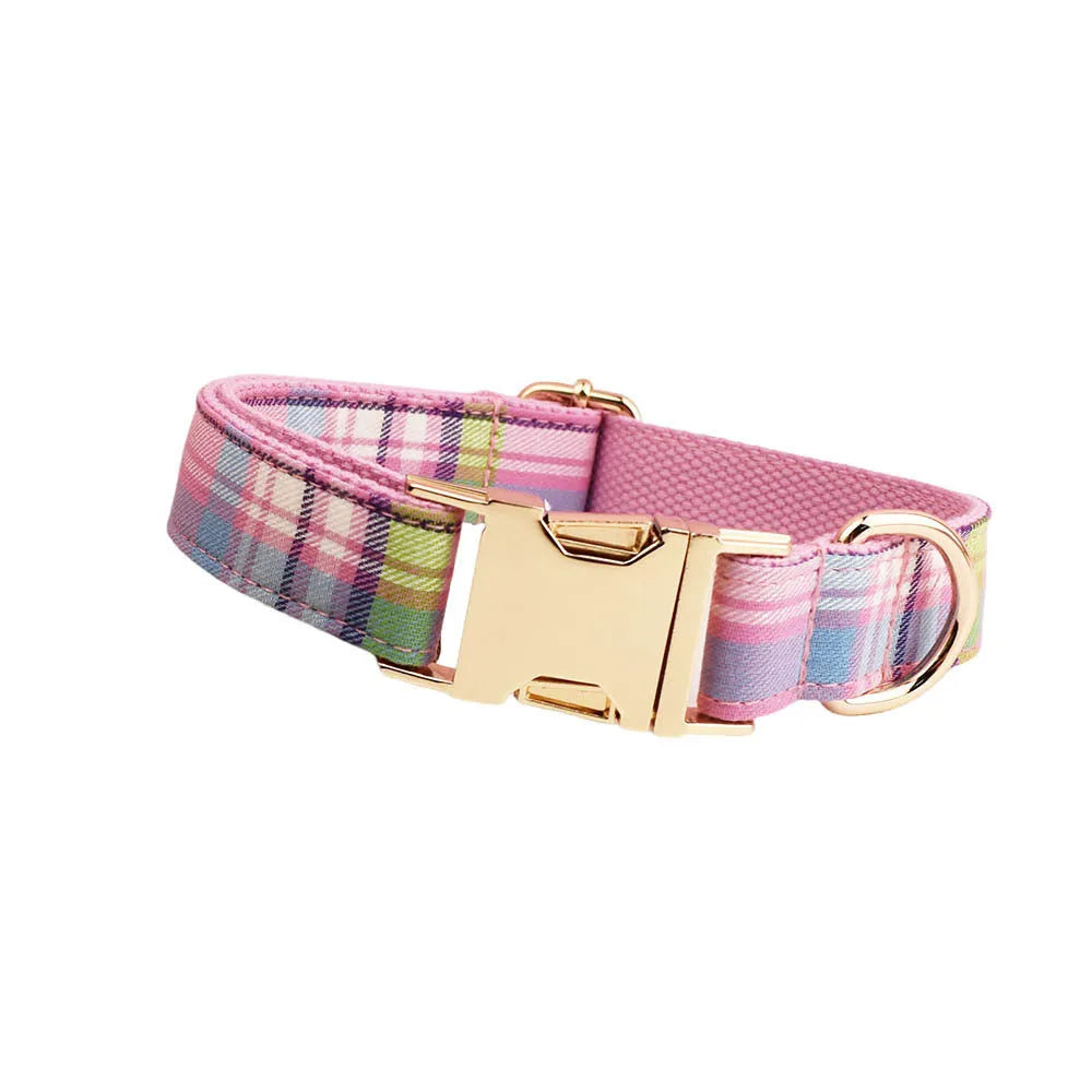 Qicaigei four-piece cloth dog collar, leash, vest, and bow set laid flat, showing assorted colour options.