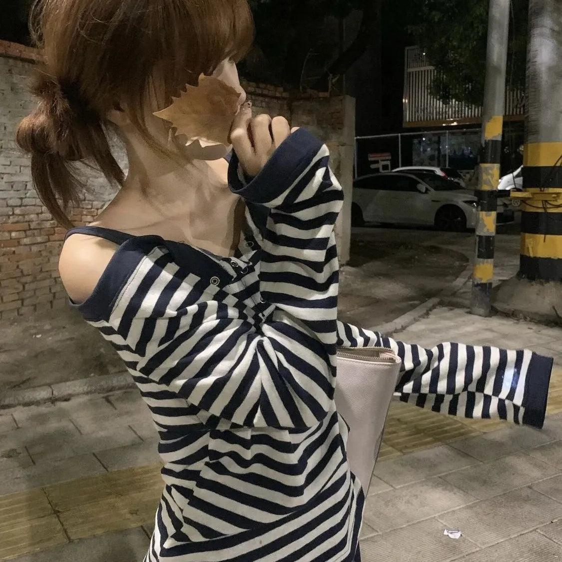 Dark blue women's oversized long-sleeve t-shirt with Korean style, embroidery, and stripe details.