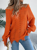 Women's white hollow-out off-the-shoulder long sleeve pullover sweater on a hanger.