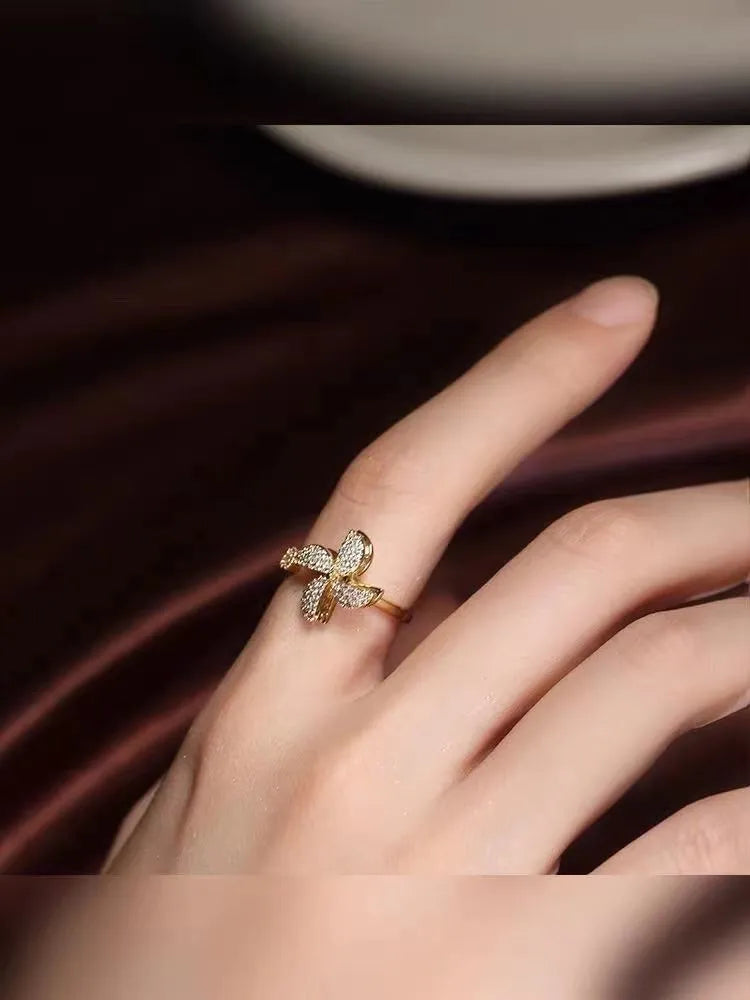 Gold and silver rotating geometric ring with micro-inlaid mechanism and electroplated finish