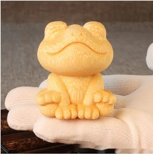 Solid bamboo smiling frog carving ornament measuring 5cm high with cartoon design