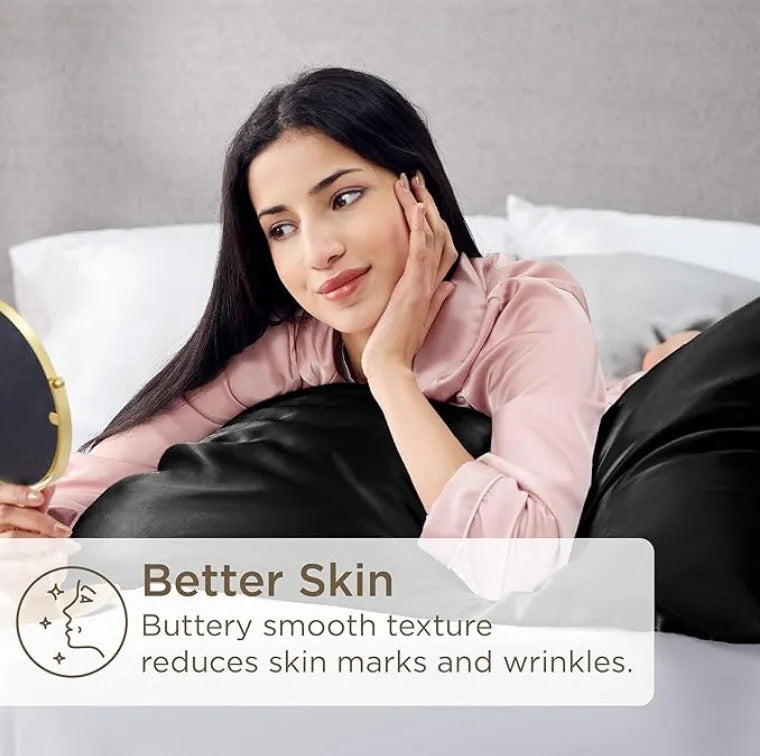 A pair of solid colour satin pillowcases in various colours and sizes on a bed.