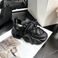 Women's creamy white wedge sneakers with cross-strap detail and lace-up front
