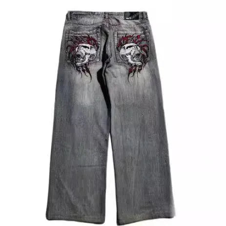 Men's washed grey wide-leg straight jeans on a neutral background.